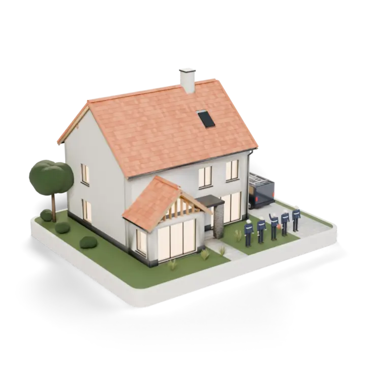Le pavillon terminé : toiture de tuiles neuve, fenêtres éclairées, l'équipe devant la maison