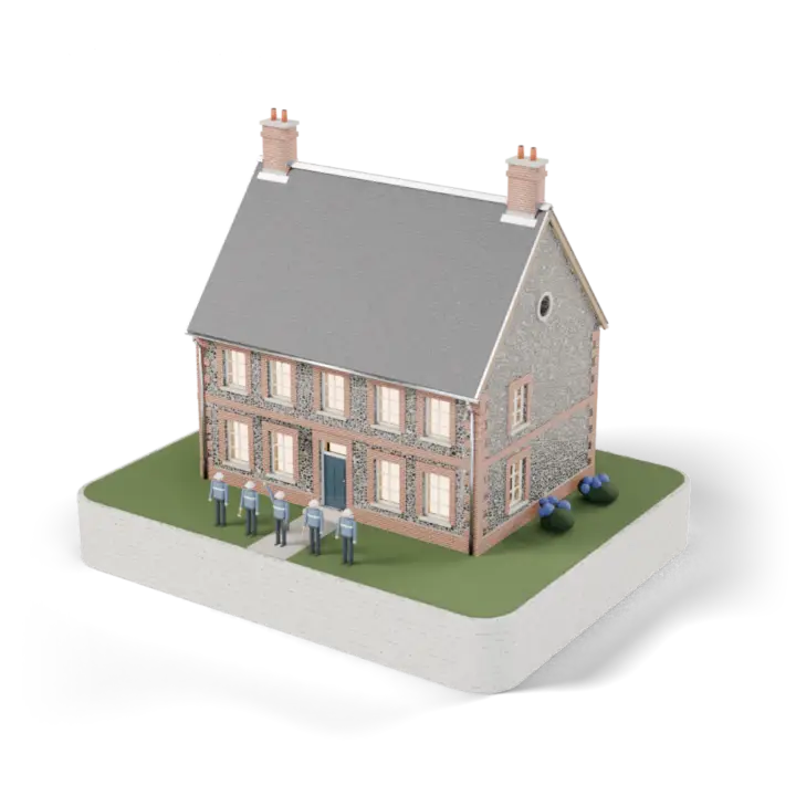 La maison terminée : toiture d'ardoise neuve, fenêtres éclairées, l'équipe de couvreurs devant