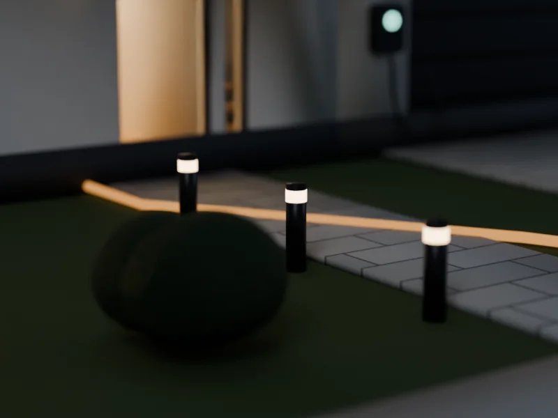 Balises lumineuses le long d'une allée de jardin, de nuit